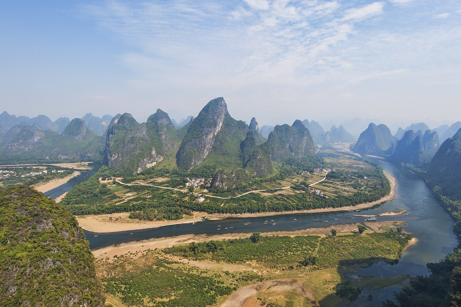 Fishing boats on the Li River between karst peaks between Guilin and Yangshuo